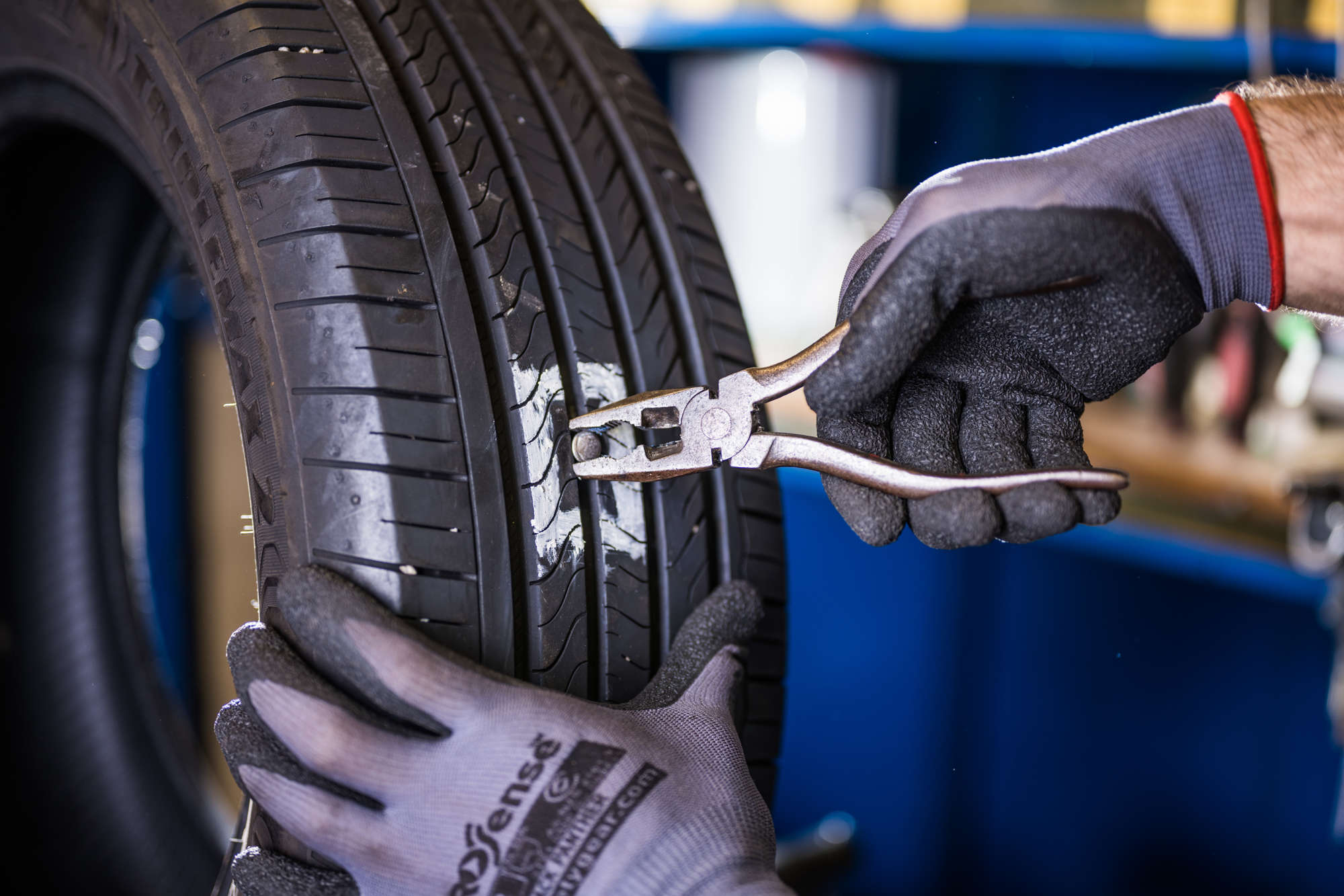 Mechanic working on repairing a tyre's puncture